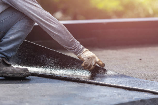 Professional Basement Waterproofing technician working in Wilmington, IL
